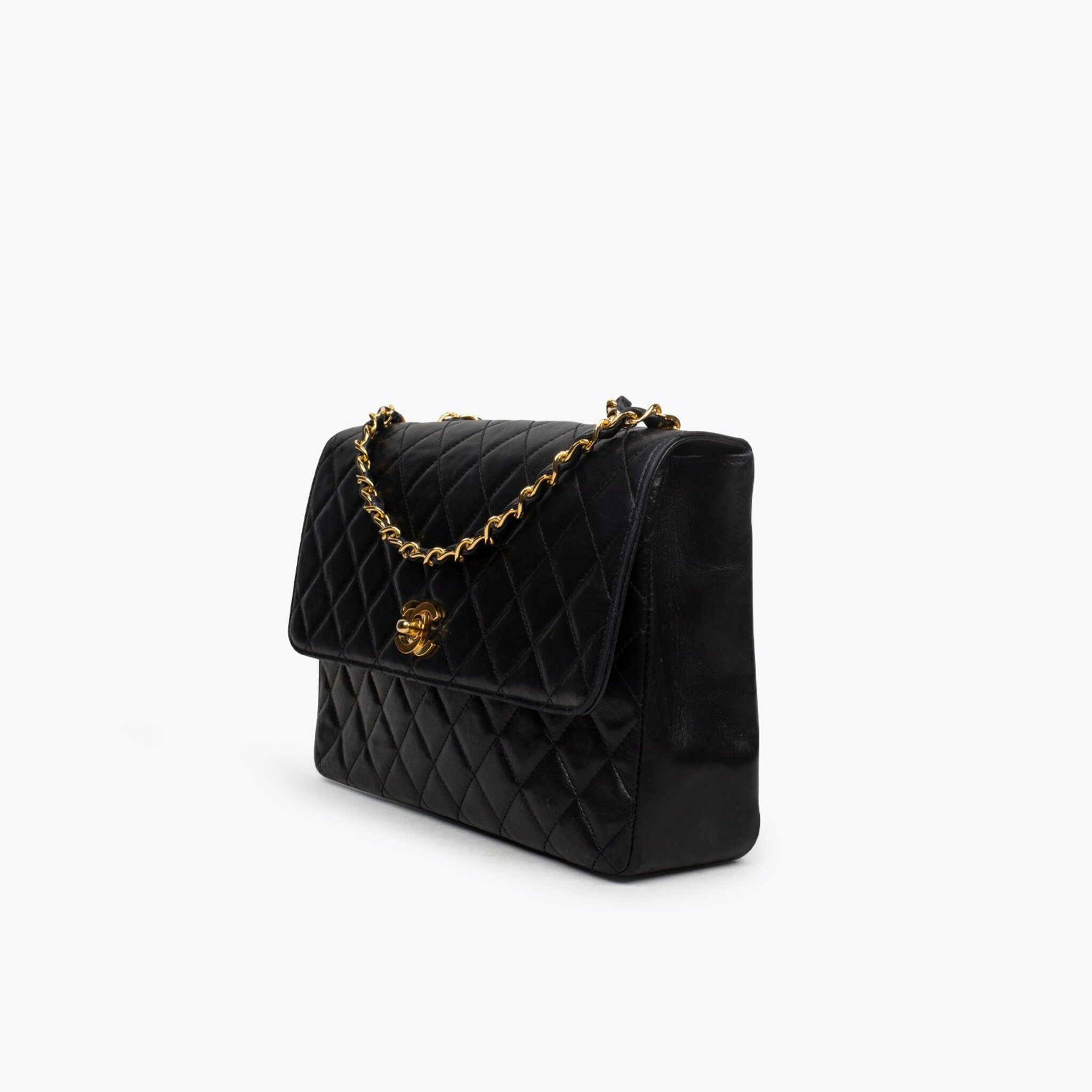 CHANEL VINTAGE JUMBO SINGLE FLAP BAG IN BLACK CHEVRON QUILTED LEATHER   Still in fashion